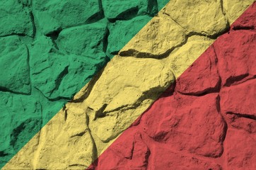 Congo flag depicted in paint colors on old stone wall closeup. Textured banner on rock wall...