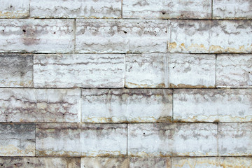 the wall is faced with stone tiles
