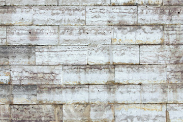 the wall is faced with stone tiles