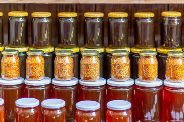 Bee pollen and honey in glass jars