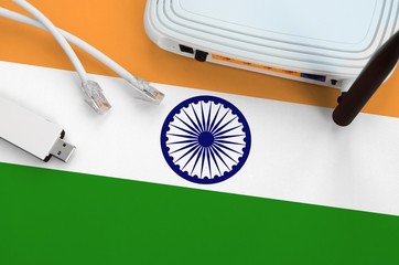 India flag depicted on table with internet rj45 cable, wireless usb wifi adapter and router....