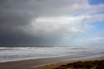 agitated ocean under a tormented sky