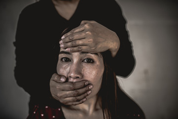 Asian hostage woman Bound with rope at night scene,The thieves kidnapped for ransom,thailand people