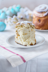 Cutted easter cake and painted eggs