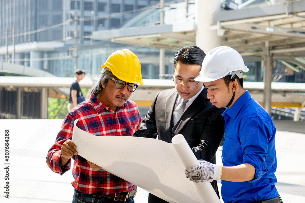 Wall mural businessman or boss manager in suit meeting with engineer outdoor