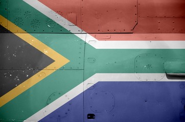 South Africa flag depicted on side part of military armored helicopter closeup. Army forces...