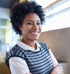 Confident young african american business woman with arms crosse
