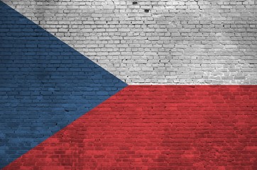 Czech flag depicted in paint colors on old brick wall. Textured banner on big brick wall masonry...