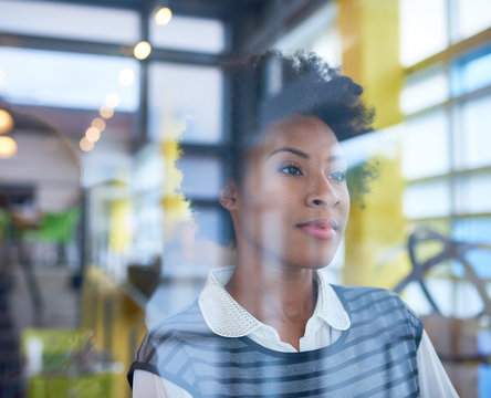 Confident young african american business woman with arms crosse
