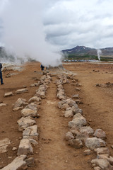 Fototapeta na wymiar Steaming sulphur fumaroles at geothermal area Hverir in Iceland. Europe