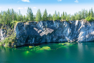 Rocks and lake of marble canyon in Ruskeala