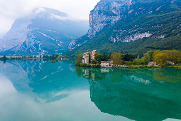 Calavino, Italy. Toblino castle on a beautiful lake.