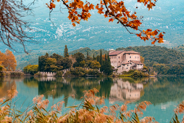 Calavino, Italy. Toblino castle on a beautiful lake.