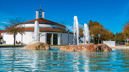 Beautiful view with reflections and a nice chapel at Therme Bad Griesbach, Bavaria, Germany
