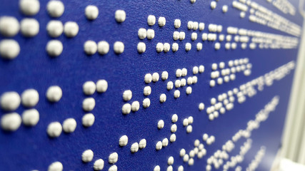Information plate. Braille. Selective focus.