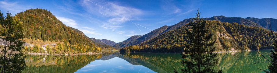 High resolution stitched panorama of a beautiful alpine view with reflections at the famous Sylvenstein lake, Bavaria, Germany