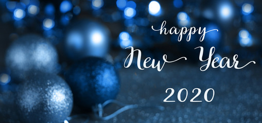 happy New Year 2020  greeting card banner . Christmas blue background with bokeh, lights and Christmas balls. defocus. blurred focus. copy space