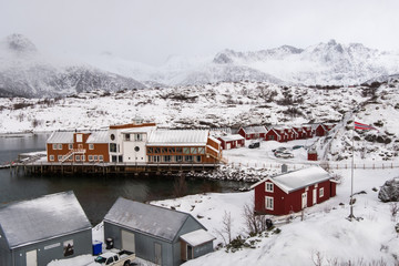 Kabelvag, Lofoten / Normay - 25 March 2018: The Lofotakvariet aquarium building, Flag of Norway and the tourists cars that visit during the winter season.