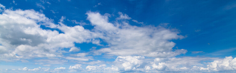Naklejka na ściany i meble Beautiful blue sky with fluffy clouds for background