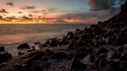 colorful sunset over rocky beach on madeira