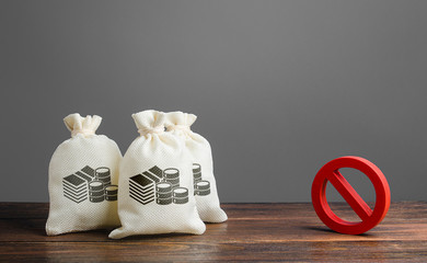 Money bags and red prohibition sign no. Restrictions on the export of capital, Economic pressure...