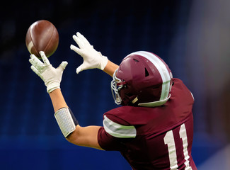 Great action photos of high school football players making amazing plays during a football game