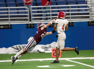 Fototapeta premium Great action photos of high school football players making amazing plays during a football game