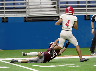 Great action photos of high school football players making amazing plays during a football game