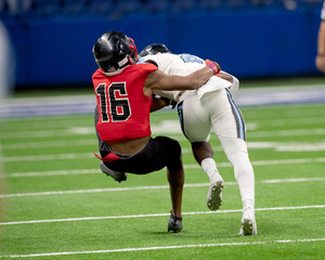 Fototapeta premium Great action photos of high school football players making amazing plays during a football game