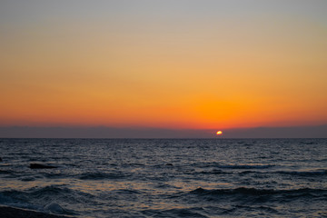 Fototapeta premium orange red sunrise at the beach