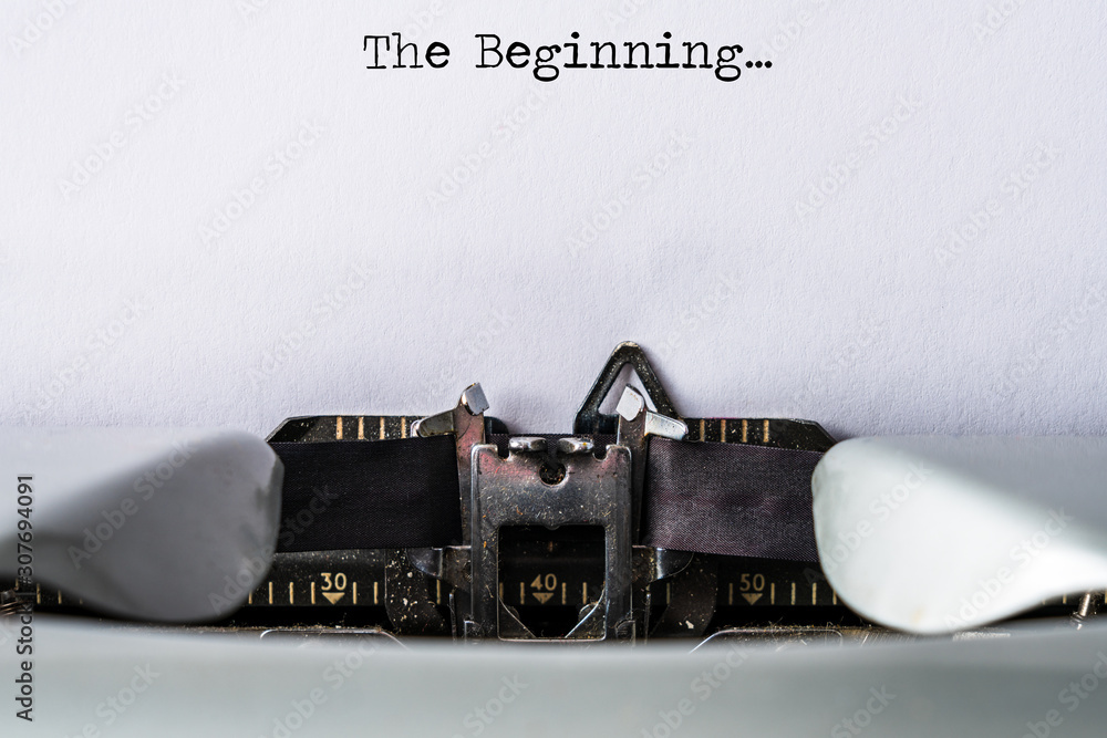 Fototapete typewriter with text the beginning as header on white paper background. copy space for own text. wri