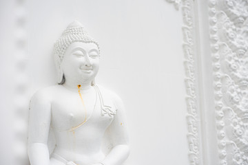  White Buddha statue in soft colors