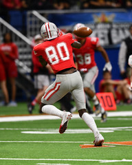Great action photos of high school football players making amazing plays during a football game