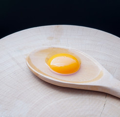 organic yolk egg on a Chopping Wood
