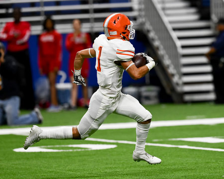 Great action photos of high school football players making amazing plays during a football game - Powered by Adobe