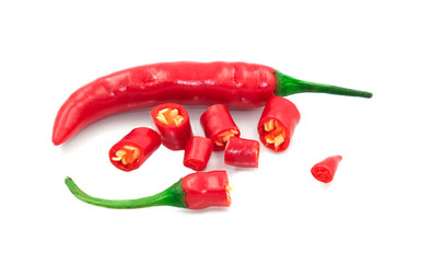 Group of fresh red hot chilli vegetable cut many pieces show seed. Prepare ingredient for thai spicy food. Isolated on white background