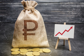 Russian ruble RUB symbol money bag and red trend arrow up chart. Deposit and savings. Increasing...