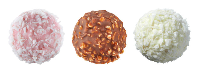 Set of three spherical candies with different fillings, nuts and coconut shavings, isolated on a...