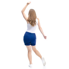 Woman in blue shorts and white shirt dancing happiness smiling looking on white background isolation, back view