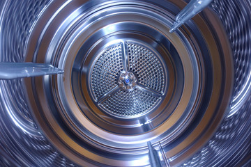 Closeup photo of latest technology stainless steel electric dryer drum