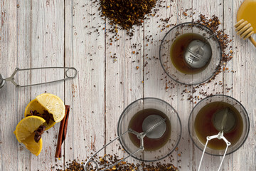 winter spices and tea on wooden background