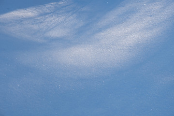 White winter snowflake texture background with deep blue shadows