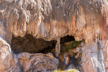 Landscape of barren stone formations and cave at Soda Dam in New Mexico