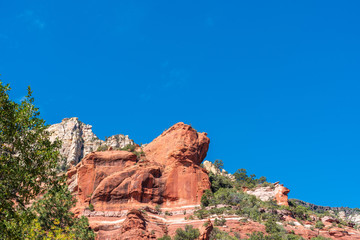 Fototapeta na wymiar Low angle landscape of red and white rock formations at Slide Rock State Park in Sedona Arizona