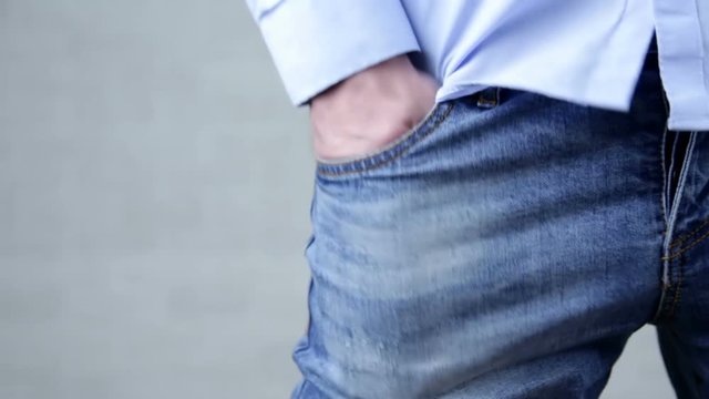 Poor businessman showing empty pants