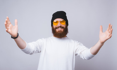 Naklejka premium Photo of happy young bearded man want to hug someone
