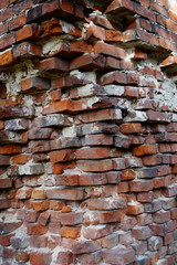corner of a half-ruined red brickwork, close up of an building