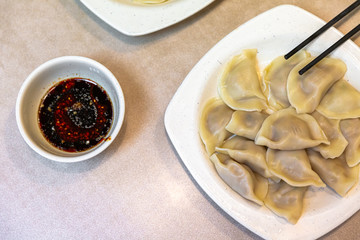 dumplings with soy sauce in a Chinese dinner