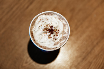 cup of coffee on wooden table