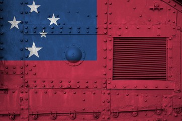 Samoa flag depicted on side part of military armored tank closeup. Army forces conceptual background